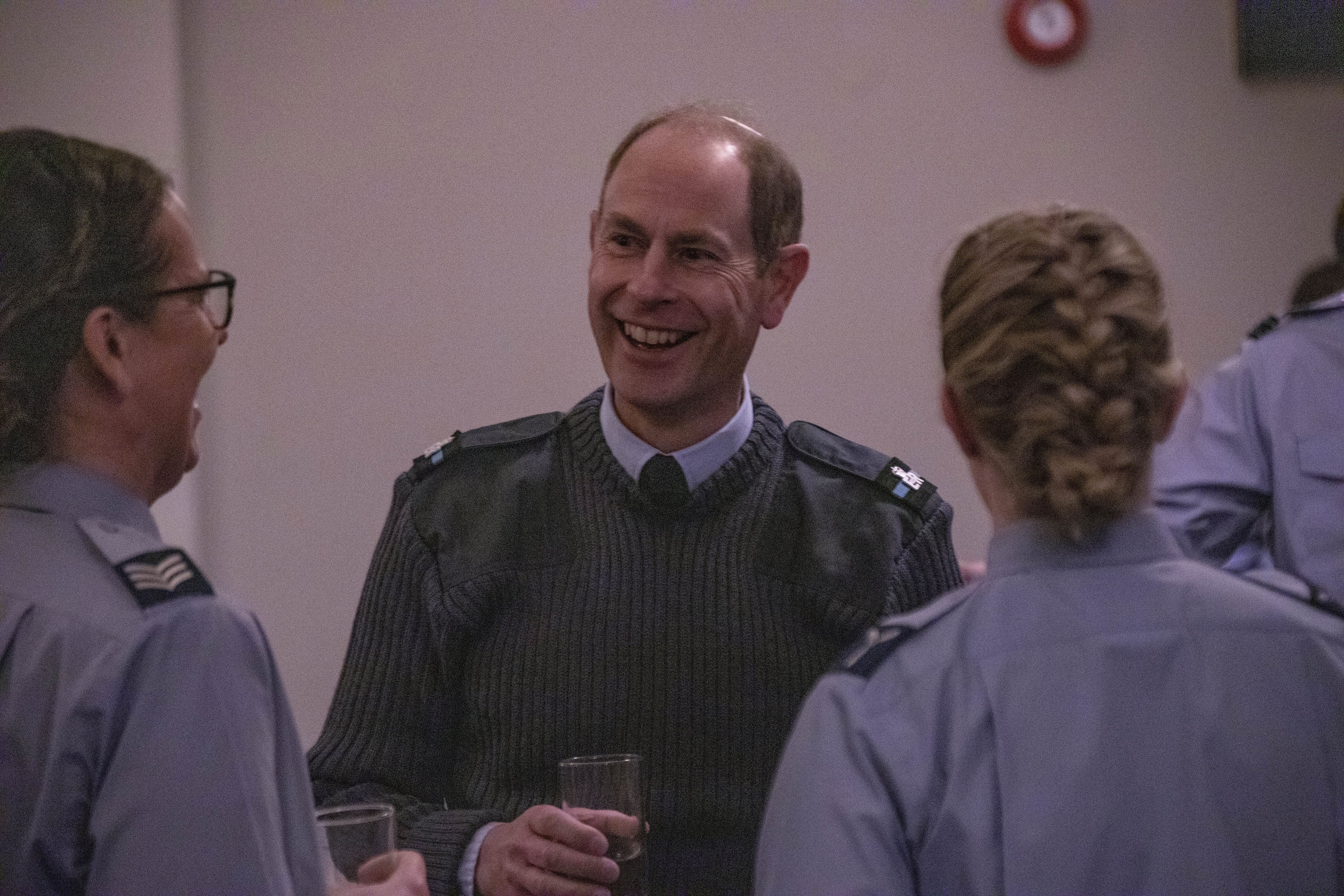 Image shows the Earl of Wessex laughing with RAF aviators.